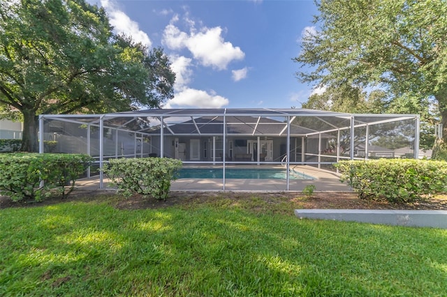 pool with a lanai and a yard