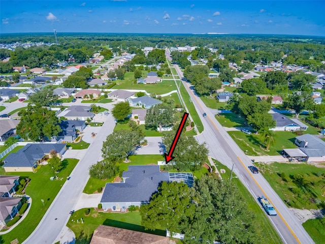 birds eye view of property with a residential view