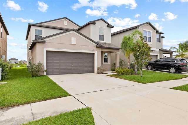 view of front facade featuring a garage and a front yard