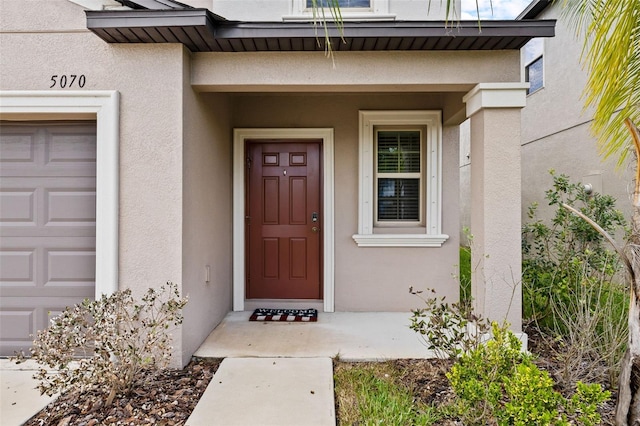 doorway to property featuring a garage