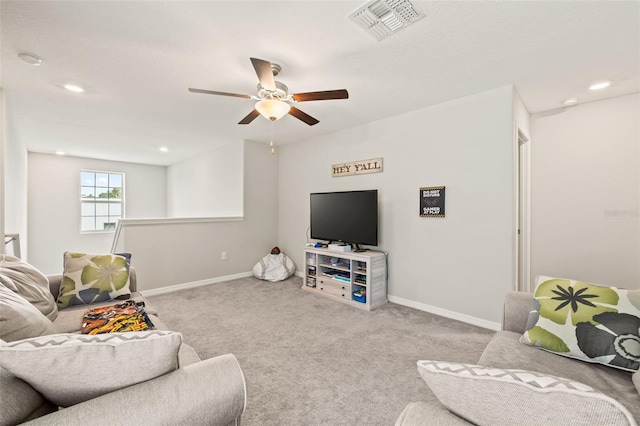 living room featuring carpet and ceiling fan