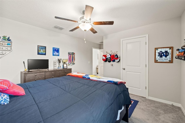 bedroom featuring ceiling fan and light colored carpet