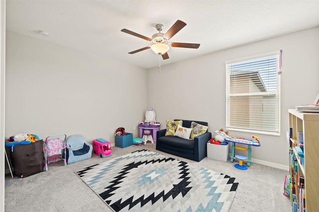 game room featuring carpet flooring and ceiling fan