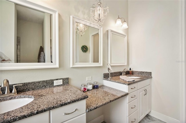 full bathroom featuring an inviting chandelier and vanity