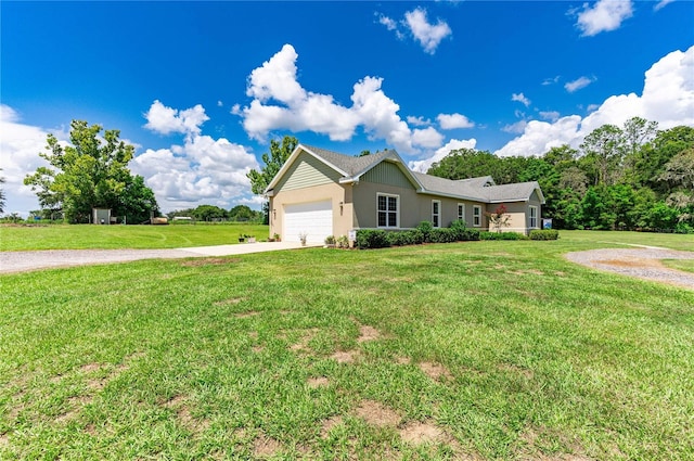 ranch-style house with concrete driveway, a front lawn, and an attached garage