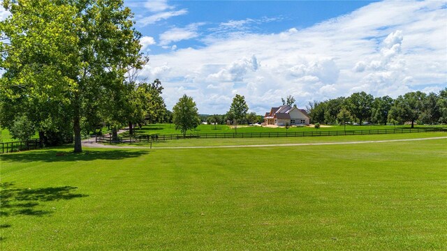 view of home's community with a yard and a rural view