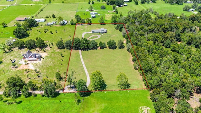 birds eye view of property with a rural view