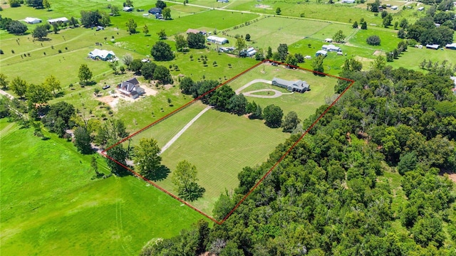 birds eye view of property with a rural view