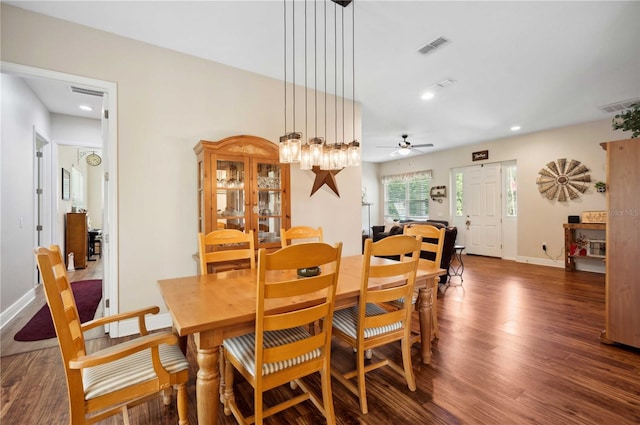 dining room featuring dark wood-type flooring and ceiling fan