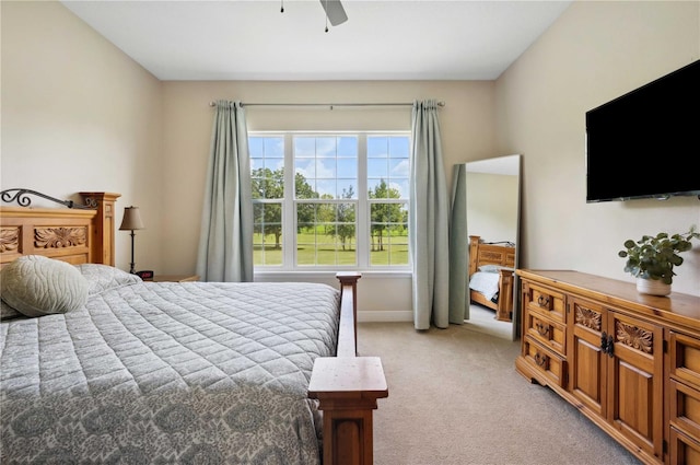 bedroom featuring ceiling fan and light colored carpet