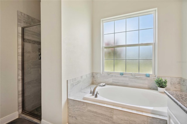 bathroom featuring vanity and separate shower and tub