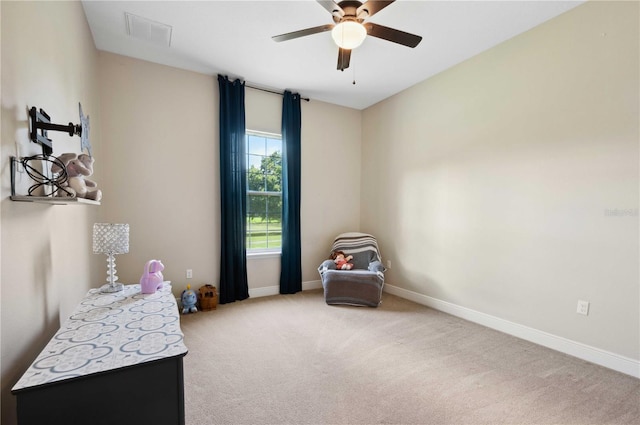 game room with ceiling fan and light carpet