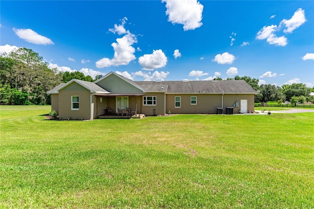 rear view of house with a lawn