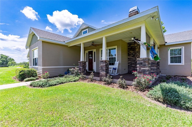 view of front of property with a porch, a front lawn, and ceiling fan