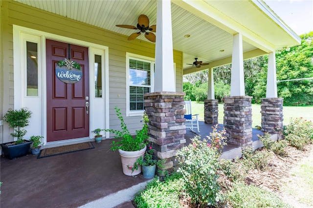 property entrance with ceiling fan and a porch