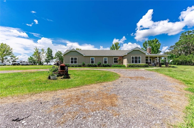 single story home featuring a front yard