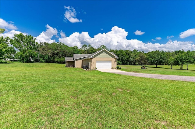 ranch-style home with a garage and a front yard