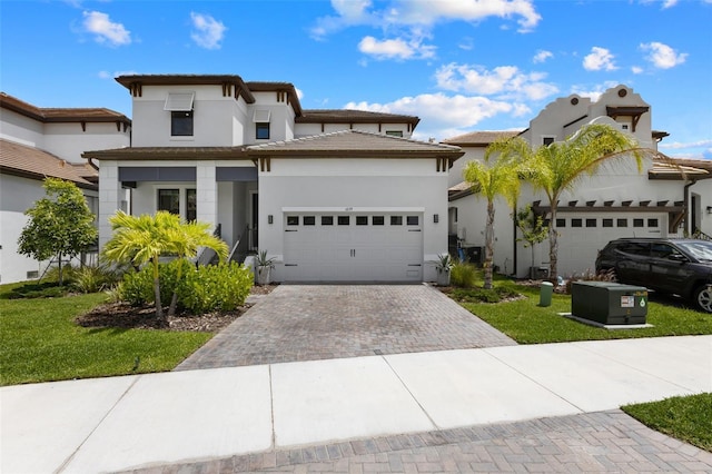 view of front of house with a garage and a front yard