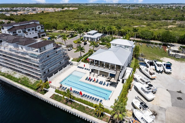 birds eye view of property with a water view