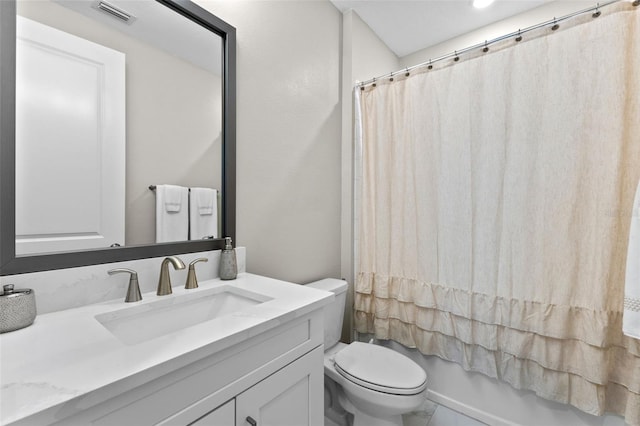 full bathroom featuring vanity, shower / bath combination with curtain, and toilet