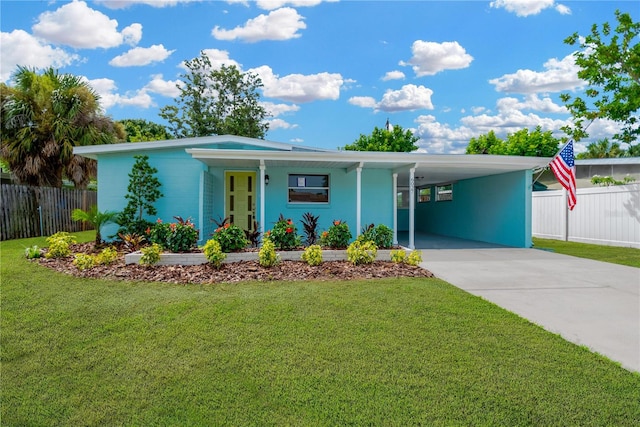 view of front of house with a porch, a carport, and a front yard