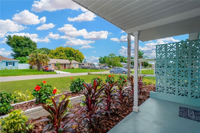 view of patio featuring covered porch and a residential view