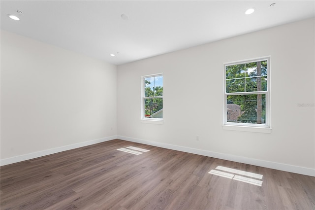 unfurnished room featuring hardwood / wood-style flooring