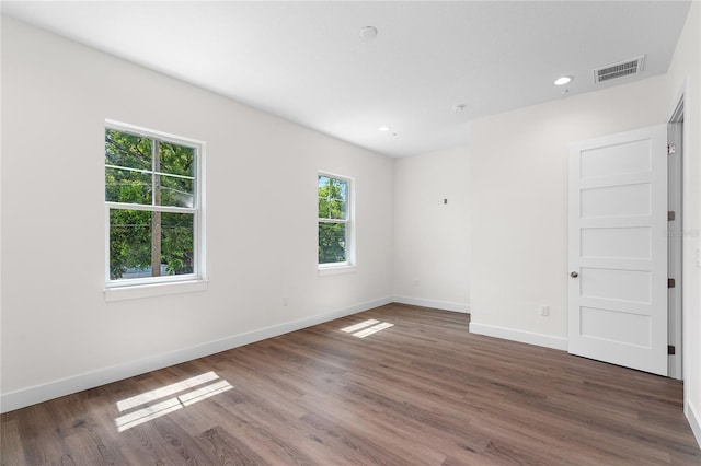 spare room featuring dark hardwood / wood-style floors