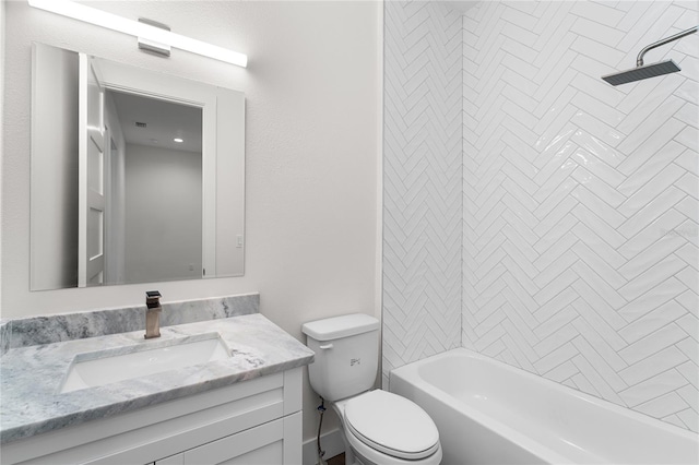 full bathroom featuring vanity, toilet, and tiled shower / bath