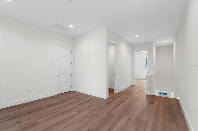 empty room with wood-type flooring