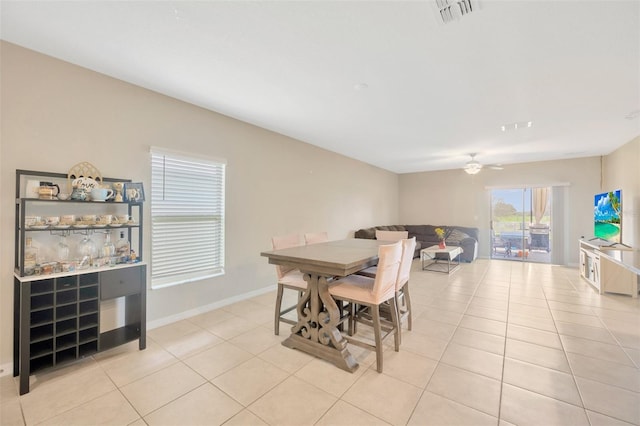 dining area with light tile patterned flooring and ceiling fan