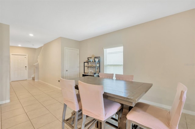 dining area with light tile patterned floors