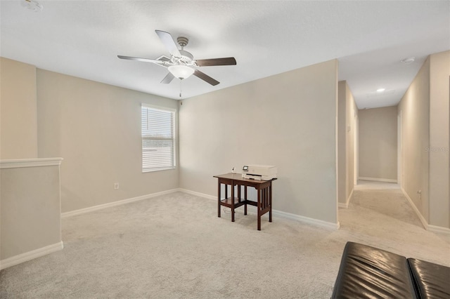 carpeted empty room with ceiling fan