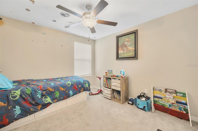 bedroom featuring light carpet and ceiling fan