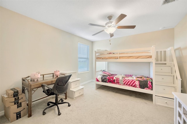 bedroom featuring light colored carpet and ceiling fan