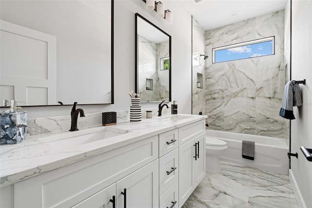 full bath with washtub / shower combination, marble finish floor, a sink, and toilet