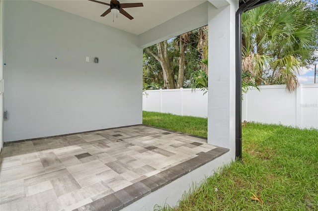 view of patio / terrace with a ceiling fan and a fenced backyard