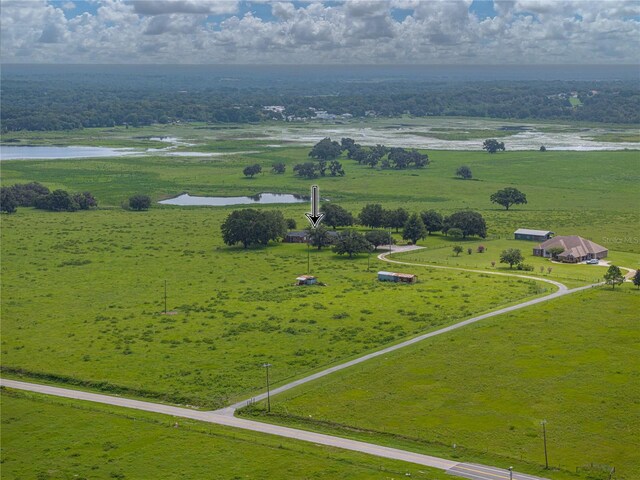 drone / aerial view with a rural view and a water view