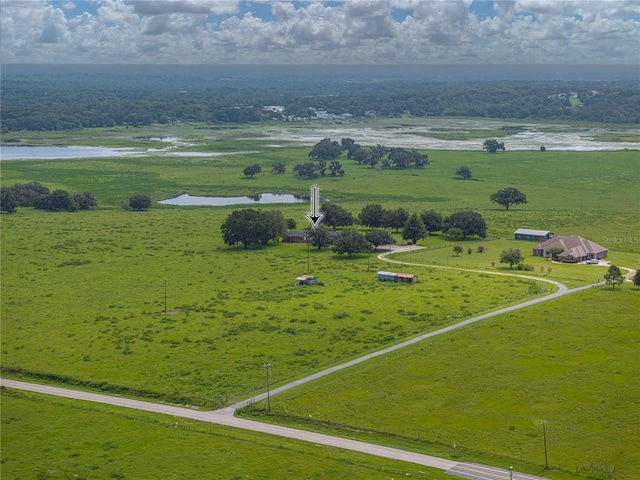 birds eye view of property with a rural view and a water view