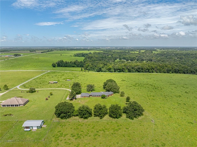 birds eye view of property with a rural view