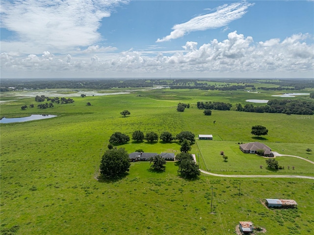 drone / aerial view with a rural view and a water view