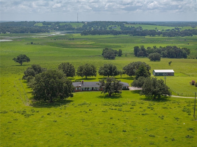 birds eye view of property with a rural view