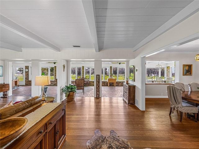 interior space featuring dark hardwood / wood-style floors and beamed ceiling