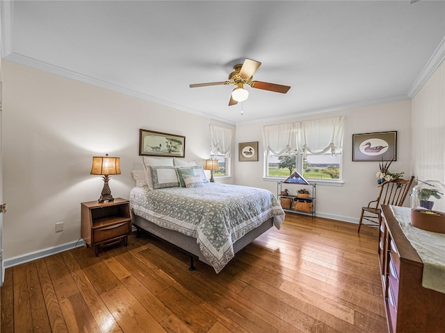 bedroom with ceiling fan, ornamental molding, and hardwood / wood-style floors