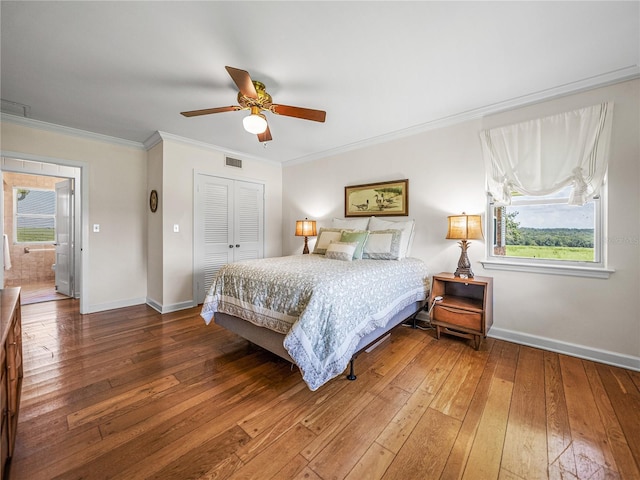 bedroom with ceiling fan, a closet, wood-type flooring, and crown molding