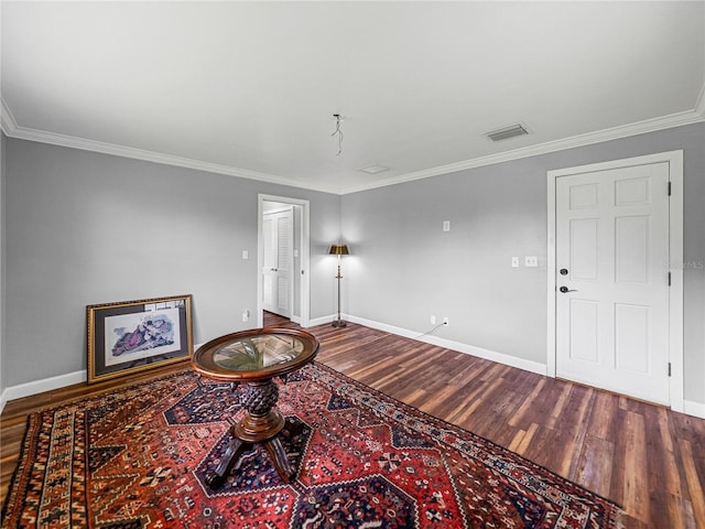 interior space featuring ornamental molding and hardwood / wood-style floors