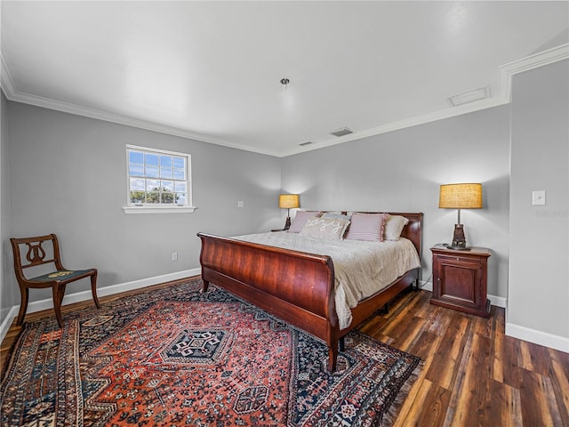 bedroom featuring ornamental molding and dark hardwood / wood-style flooring