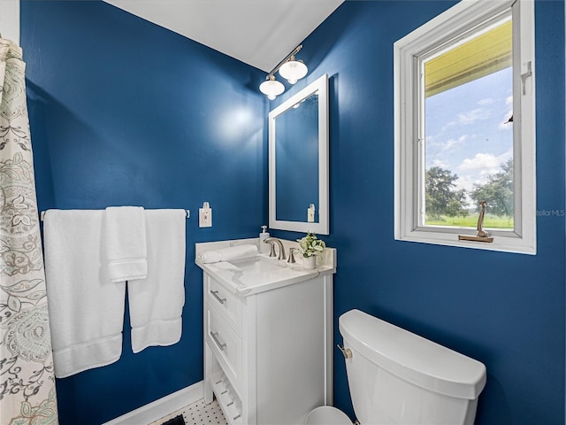 bathroom featuring toilet and vanity