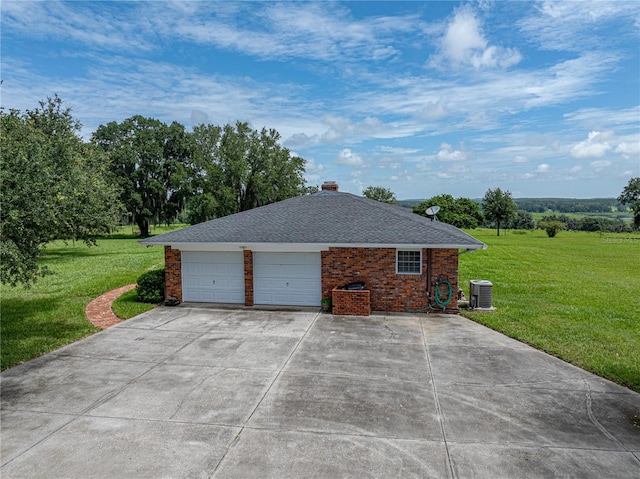 view of property exterior with central AC, a yard, and a garage