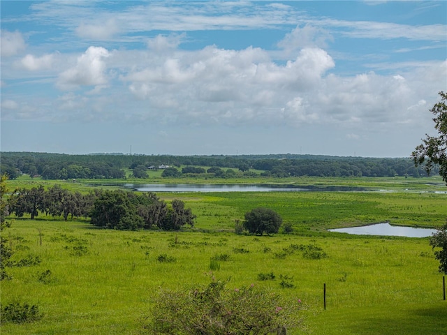 exterior space with a water view and a rural view